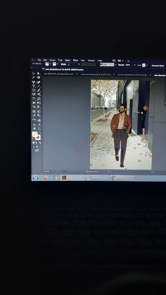 a computer screen showing a man walking down the street