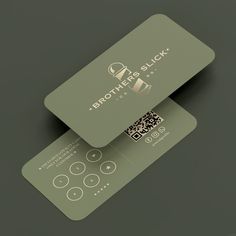 two business cards sitting on top of each other