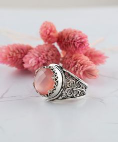 Pink Chalcedony Silver Floral Boho Statement Ring 925 Sterling Artisan Made Jewelry Handcrafted Filigree Genuine Gemstone Cocktail Ring, Handmade rings jewelry Material: 925 Sterling Silver ( NICKEL FREE ) Gemstone: Pink Chalcedony 12 mm. FREE, FAST AND TRACKABLE SHIPPING FOR ALL EU COUNTRIES AND USA. -That ring is so stunning and dainty. Perfect for everyday wear. There is a gorgeous small Flower on the band of the ring and Chalcedony Gemstone that dainty. This pink stone ring is made from our Bohemian Oval Jewelry With Accent Stones, Traditional Gemstone Rings, Bohemian Rings With Gemstone Accents For Anniversary, Bohemian Sterling Silver Jewelry With Accent Stones, Bohemian Anniversary Rings With Gemstone Accents, Cabochon Filigree Ring Gift, Silver Filigree Ring With Stone Setting, Bohemian Pink Rings For Anniversary, Bohemian Pink Ring For Anniversary