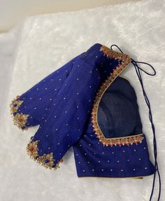 Hand embroidered ready made saree blouse / crop top/stitched saree blouse usa /  pure silk saree blouse/jewelry style kundan hand embroidered blouse/zardosi blouse/blue saree blouse/ pure silk blouse/pure silk blue maggam work blouse        It is very true that a perfect blouse is the one which makes your saree look stand out !! If you find one of such a style that you have been wanting to have then dont let it go !! we carry such unique trending blouses that instantly add a stylish look to any saree !!     Well..!! we understand that you may not get in your desired size/pattern, here you go with customization according to your size/pattern which we can deliver in 1-2 weeks of time period !!      Here is a beautiful Hand embroidered saree blouse in pure raw silk in blue color that has heav Blue Raw Silk Saree With Unstitched Blouse, Blue Blouse With Intricate Embroidery In Traditional Drape, Blue Designer Tops With Zari Work, Designer Blue Tops With Zari Work, Blue Blouse With Zari Work For Wedding, Festive Blue Blouse With Intricate Embroidery, Blue Raw Silk Blouse Piece With Zari Work, Fitted Blue Raw Silk Pre-draped Saree, Fitted Blue Pre-draped Raw Silk Saree