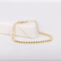 "14K Solid Gold Ball Chain Bracelet, 2mm Gold Beads Bracelet, Simple Minimalist Bracelet, Layering Bracelets, Gifts for Her ≫ Product Details ◈ Handmade / Handcrafted Fine Jewelry ◈ Thickness: 2.0 mm ◈ Metal: Solid 14K Gold ◈ Chain Length: 6\" ~ 7.5\" ≫ Please read our FAQ below for more detail." Gold Beads Bracelet, Ball Chain Bracelet, Gold Ball Chain, Layering Bracelets, Bracelet Layering, Bracelet Simple, Gold Anklet, Gold Bead Bracelets, Minimalist Bracelet