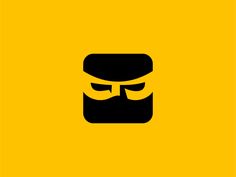 a man with a beard and mustache in the middle of a yellow square logo design