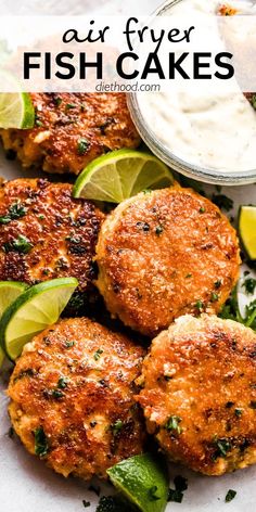 fish cakes with limes and sour cream on the side