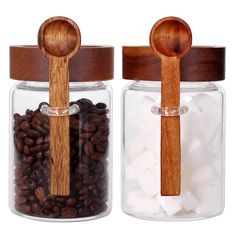 two jars with wooden spoons and beans in them