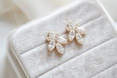 This pair of stunning rose gold cubic zirconia stud bridal earrings was meant to be worn by ladies on the most special day of their lives. Ever since we created the design for this elegant piece of jewelry, we imagined a romantic, modern bride wearing them as she walks down the aisle – and seeing them, we bet you can imagine yourself wearing them too!- Handcrafted with Premium cubic zirconia stones - All clear stones - Rhodium, yellow gold or rose gold finish- Earrings measures 1.25" x .625"- Ni Rose Gold Diamond Crystal Earrings For Wedding, Rose Gold Cubic Zirconia Diamond Earrings For Wedding, Rose Gold Diamond Bridal Earrings For Wedding, Rose Gold Elegant Diamond Earrings For Wedding, Glamorous Wedding Diamond Earrings With Brilliant Cut, Glamorous Brilliant Cut Diamond Earrings For Wedding, Elegant Rose Gold Diamond Earrings With Sparkling Stones, Elegant Rose Gold Cubic Zirconia Cluster Earrings, Dazzling Rose Gold Cubic Zirconia Bridal Earrings