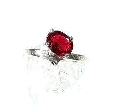 Immerse yourself in the world of elegance and charm with this pretty fashion jewelry ring, which is refined with a red glass stone. The ring, made of high-quality 925 silver plated, radiates a timeless shine with its silver plating and brings a touch of passion to your jewelry repertoire. The ring head, with a generous width of approximately 1 cm, proudly showcases the sparkling red glass stone that plays with every ray of light and surrounds your hand with a mysterious aura. The ring size EU 58 Sterling Silver Red Ring For Promise, Red Sterling Silver Ruby Ring Hallmarked, Red Nickel Free Rings, Red Ruby Solitaire Jewelry, Sterling Silver Hallmarked Red Ruby Ring, Hallmarked Ruby Ring In Sterling Silver, Adjustable Red Gemstone Birthstone Ring, Red Sterling Silver Crystal Ring, Red Oval Sterling Silver Crystal Ring