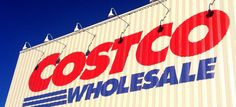 a large sign on the side of a building that says costco wholesale