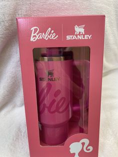 the pink barbie travel mug is in its box