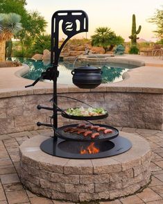 an outdoor bbq grill with food cooking on it in front of a swimming pool