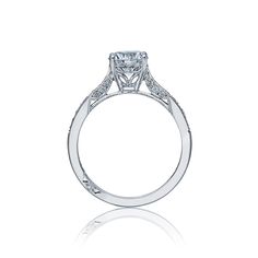 a diamond engagement ring on a white background