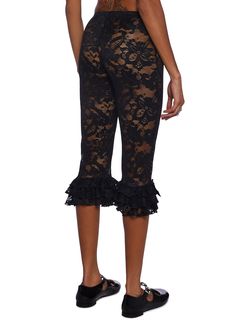 These pants have a stretchy sheer floral lace construction, a tiered ruffled hem with bow appliques, an elastic waistband, and a self-tie lace-up front closure. Fitted Black Lace Pants, Black Lace Bottoms With Delicate Lace Detail, Black Lace Mini Bottoms, Black Lace Brief Bottoms, Halloween Costume Boots, School Halloween Costumes, Dolls Kill Outfits Black, Costume Boots, Lace Pants