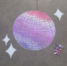 there is a drawing on the ground with crayons in front of it and stars