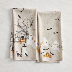 two napkins decorated with halloween images on them