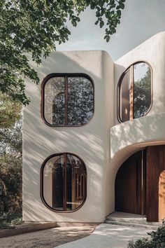 an unusual house with three circular windows