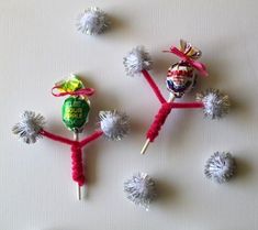 three small candy lollipops are placed in the shape of dandelions