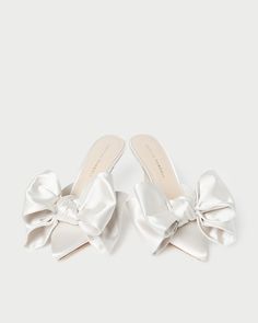 Closed-toe mule with bow detail in cream satin. Features a padded leather footbed with gold stamped logo and a pointed toe. 3-inch heel. Bow Mules, Luxury Heels, Fall Palette, Loeffler Randall Shoes, Spring Palette, Autumn Bride, Fall Events, Low Heel Sandals, Wrap Sandals