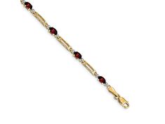 14k yellow gold and rhodium over 14k yellow gold diamond and 2.40 ctw garnet bracelet. Measures approximately 1/8 of an inch in width and has a lobster claw closure. Garnet Bracelet, Lobster Claw, Diamond Bracelet, Gold Diamond, Garnet, Yellow Gold, Bracelet, Yellow, Gold