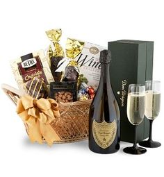 champagne and chocolates in a basket with two flutes