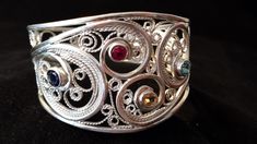 Woman Sterling Silver & Gemstone Cuff Bracelet, Sterling Silver Cuff Bracelet, Sterling Silver Filigree Cuff Bracelet, by FireandLaceJewelry on Etsy https://www.etsy.com/listing/224807951/woman-sterling-silver-gemstone-cuff Elegant Silver Multi-stone Cuff Bracelet, Ornate Cuff Bracelet With Intricate Design For Anniversary, Unique Filigree Bangle Cuff Bracelet, Unique Silver Filigree Cuff Bracelet, Adjustable Sterling Silver Filigree Cuff Bracelet, Ornate Sterling Silver Cuff Bracelet Bangle, Ornate Sterling Silver Cuff Bracelet For Anniversary, Silver Multi-stone Cuff Bangle, Ornate Sterling Silver Filigree Cuff Bracelet