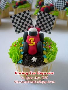 cupcakes with race cars on top and grass in the middle