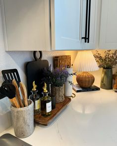 the kitchen counter is clean and ready to be used as cooking utensil holder