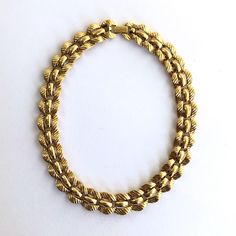 This beautiful gold tone necklace from Monet is a versatile wardrobe piece. This timeless style can enhance an outfit to look more dressy or be an every day necklace. 18" long Links are 3/4" wide.  Links are very pliable and drapes with the contours of the body very well. Fold over clasp is in very good condition. Marked Monet on clasp. Thank you. Gold Chain Necklace, 16 Inch For Formal Occasions, Every Day Necklace, Vintage Monet, Versatile Wardrobe, Link Chain Necklace, Gold Tone Necklace, Classic Gold, Chain Link Necklace, Link Chain