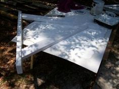 the table is being prepared for painting in the woods