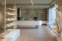 the inside of a store with shelves and counter tops