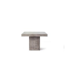 a concrete table on a white background with no one around it or someone else to the side