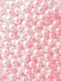 pink and white pearls are shown in this image