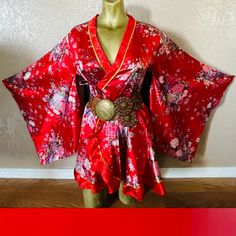 "This is a beautiful vintage 90's satin kimono.  No tags, medium-weight satin in red with floral print and gold trim.  Beautiful huge kimono sleeves (not vented).  Item has one inner tie and one outer tie at waist (belt not included).  Approximate uncinched measurements are 34\" at bust, 33\" at waist, 50\" at hips, 32\" in length, 28\" in sleeve length, 40\" around cuffs, 17\" shoulder-to-shoulder.  Mannequin measures 34C at bust, 26\" at waist, 34\" at hips.  Item sold in gently-used condition." Fitted Satin Kimono, Fitted Red Kimono For Spring, Red Kimono With Kimono Sleeves For Festival, Spring Party Satin Kimono, Red Robe With Kimono Sleeves For Spring, Fitted Red Long Sleeve Kimono, Spring Satin Kimono With Kimono Sleeves, Floral Print Kimono, Kimono Vintage