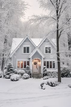 a house with snow on the ground and trees