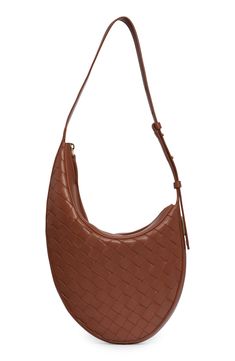 A slightly asymmetric shape adds to the subtle structure of this Italian bag woven in the brand's signature style. Top zip closure Adjustable shoulder strap Leather Made in Italy Designer Handbags Chic Business Shoulder Bag With Intrecciato Weave, Brown Woven Leather Shoulder Bag For Business, Intrecciato Weave Shoulder Bag For Business, Modern Leather Shoulder Bag With Intrecciato Weave, Elegant Brown Intrecciato Weave Hobo Bag, Modern Brown Woven Leather Hobo Bag, Modern Leather Hobo Bag With Intrecciato Weave, Chic Formal Hobo Bag With Intrecciato Weave, Chic Woven Leather Shoulder Bag For Office