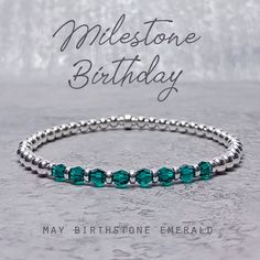 "An elegant and dainty stacking bracelet in Sterling Silver accented with Emerald Swarovski Crystals - the birthstone for May. This Swarovski Crystal and Silver stretchy layering bracelet is a lovely and subtle way to celebrate a special milestone Birthday in May with an Emerald Swarovski Crystal for each amazing decade. This bracelet can be made for milestone birthdays, 30th, 40th, 50th, 60th, 70th and 80th and would include the relevant number of crystals for each decade. A jewellery card will be included in the box showing the Birthday, Month, Birthstone and the meaning of the number of crystals, as shown in the product images. This bracelet also makes a great gift for a 'non milestone' May birthday and can made with any number of different crystals from 1 - 8 to suit the recipient, to Birthstone Bracelets With Round Beads For Birthday, Round Beaded Birthstone Bracelets For Birthday, Round Beads Birthstone Bracelets For Birthday, Stackable Jewelry With Round Beads For Birthday, Stackable Round Beads Jewelry For Birthday, Mother's Day Birthday Birthstone Beaded Bracelets, Mother's Day Birthday Beaded Birthstone Bracelets, Mother's Day Beaded Birthstone Bracelets For Birthday, Elegant Crystal Bracelet For Birthday