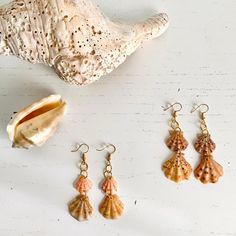 Beautiful handmade seashell earrings. Setting Sun Collection 🐚 Each earring is made up of two seashells in raw and pinkish colors that come from the beautiful beaches of the Malaga Costa del Sol in the south of Spain. The gold hook and earrings further enhance these little marine treasures. Perfect for adding a coastal and cheerful touch to your look, or as a gift for beach, sea and nature lovers 🏜 These earrings are delicate pieces, as they are made of small natural shells. To extend their du Ocean-inspired Shell Earrings As Gift, Ocean-inspired Shell Earrings, Shell-shaped Jewelry With Matching Earrings For The Beach, Summer Ocean-inspired Shell Earrings, Ocean-inspired Shell Dangle Earrings, Diy Jewelry Display, Beach Finds, Seashell Earrings, South Of Spain