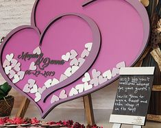 a table topped with a cake covered in hearts