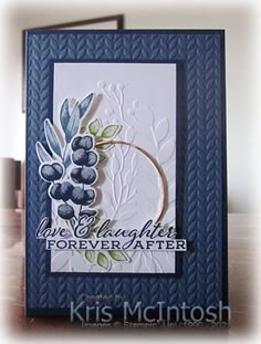 a close up of a greeting card with grapes on the front, and leaves on the back