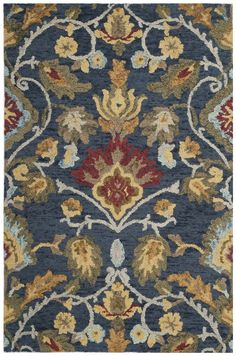 a blue and red rug with an ornate design on the bottom, in various colors