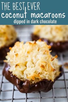 the best ever coconut macaroons dipped in dark chocolate are on a cooling rack