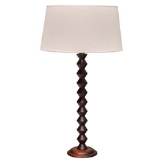 a table lamp with a white shade on it's base and a wooden base