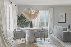 a living room filled with furniture and a white table surrounded by chairs next to a window