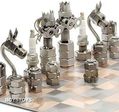 a metal chess board with many different types of valves and fittings on the sides