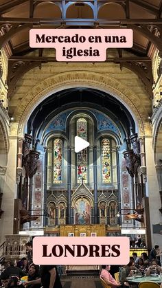 the inside of a church with people sitting at tables