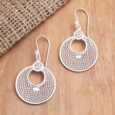 Inspired by the beauty of the lunar eclipse Selly Sagita in Java designs these elegant silver earrings. Javanese artisans hand craft the pair from sterling silver filigree twisting fine threads of the precious metal to create intricate patterns. Filigree Jewelry, Lunar Eclipse, Hand Craft, Sterling Silver Filigree, Sterling Silver Dangle Earrings, Precious Metal, Silver Filigree, Artisan Craft, Intricate Patterns