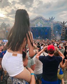 a group of people standing in front of a stage