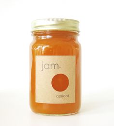 a jar of jam sitting on top of a white table