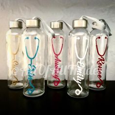 four personalized water bottles with stethoscopes on them