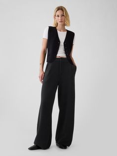 Supersoft cotton-blend sweater trousers.  Button closure, zip fly.  Front slant pockets.  Pleating at front.  This trouser is made with 25% recycled polyester.  Compared to virgin materials, using recycled materials helps to reduce resource use and waste.  Fit: Relaxed.  An easy silhouette throughout.  Models wearing Gap Hip Business Casual, Black Trouser Office Outfit, Avant Garde Office Wear, Hip Hop Business Casual, Punk Business Attire, Smart Business Casual Women Work Clothes, Nonbinary Office Fashion, All Black Outfit Business Casual, Formal Trousers Outfit