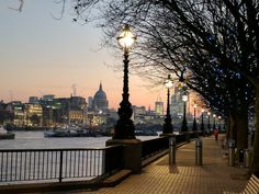 a street light on the side of a river