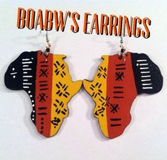 These hand painted earrings are painted with acrylic paint & coated with a protective clear gloss finish on lightweight wood. Gold, copper, or silver plated fish hooks earwires. You will love these Earrings! Get Yours Today! Size: 31/2in long (Note) Items that are hand carved and hand painted will vary in color, shape and design Afrocentric Earrings Myafricangold, Shrinky Dink Earrings, African Designers, Afrocentric Earrings, Africa Earrings, Hair Earrings, Abstract Earrings, Hand Painted Earrings, African Earrings